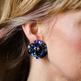 Model wearing Schreiner blue earrings