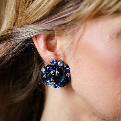 Model wearing Schreiner blue earrings