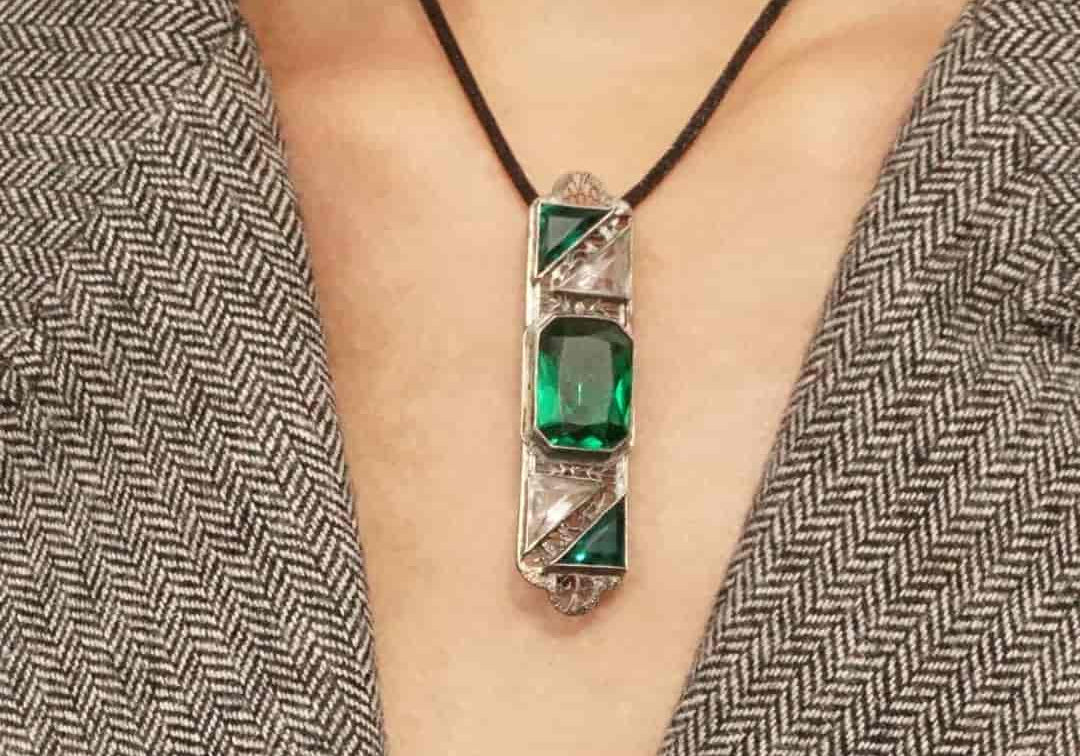 Ostby & Barton Art Deco emerald glass, crystal and sterling silver filigree brooch worn as a pendant