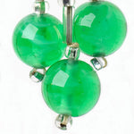 Close-up view of emerald-glass balls