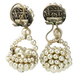 Earring backs showing company's signature ear clip