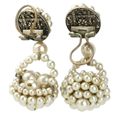 Earring backs showing company's signature ear clip