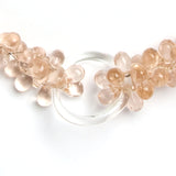 Close-up view of poured-glass beads and rings
