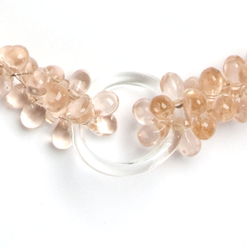 Close-up view of poured-glass beads and rings