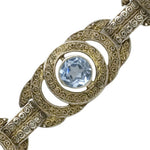 Close-up view of filigree link with aquamarine
