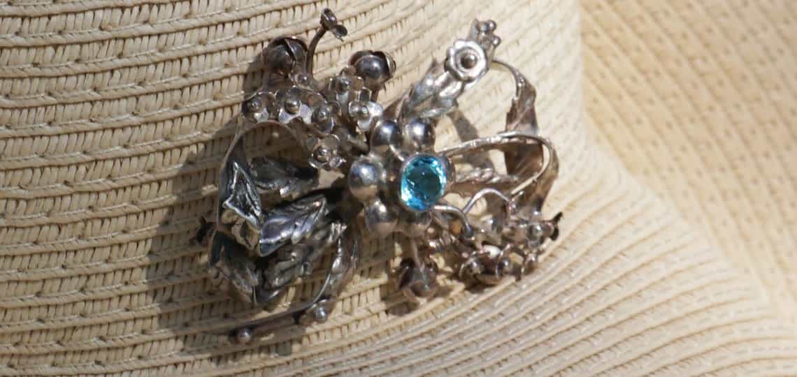 1940s Hobe aquamarine & sterling bow brooch on summer straw hat