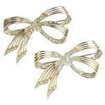 Pair of 1950s brooches with delicate gold & pave ribbons