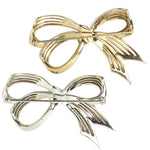 Backs of Boucher bow brooches w/maker's marks