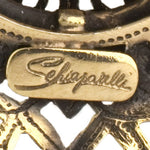 Schiaparelli maker's mark on brooch