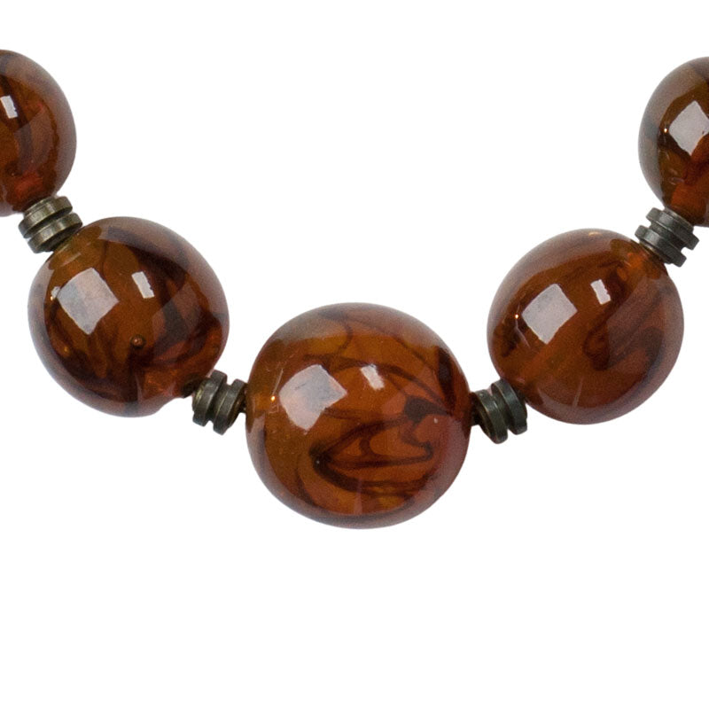 Close-up view of gorgeous hand-wound & finished beads w/black swirls