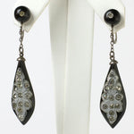 Black dangling earrings with diamanté-inlaid pendants