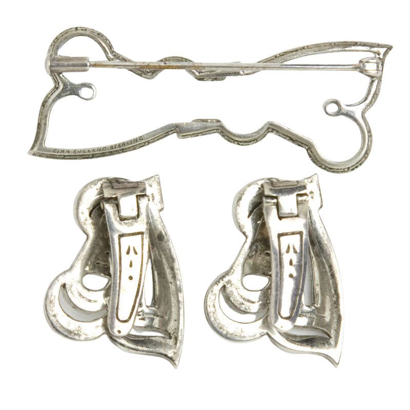 Dress clips and their brooch mechanism