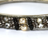 Close-up view of diamantes, faux pearls & beads