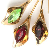 Close-up view of amethyst, ruby & peridot glass stones