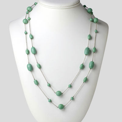 Long turquoise bead necklace on silver-tone chain