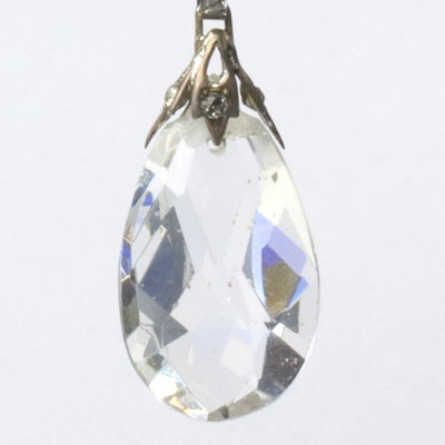 Close-up view of teardrop-shaped faceted glass