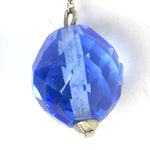 Close-up of faceted blue glass bead