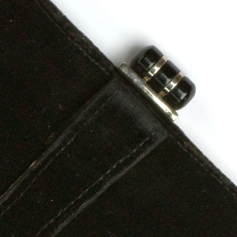 Close-up view of black Bakelite & chrome clasp