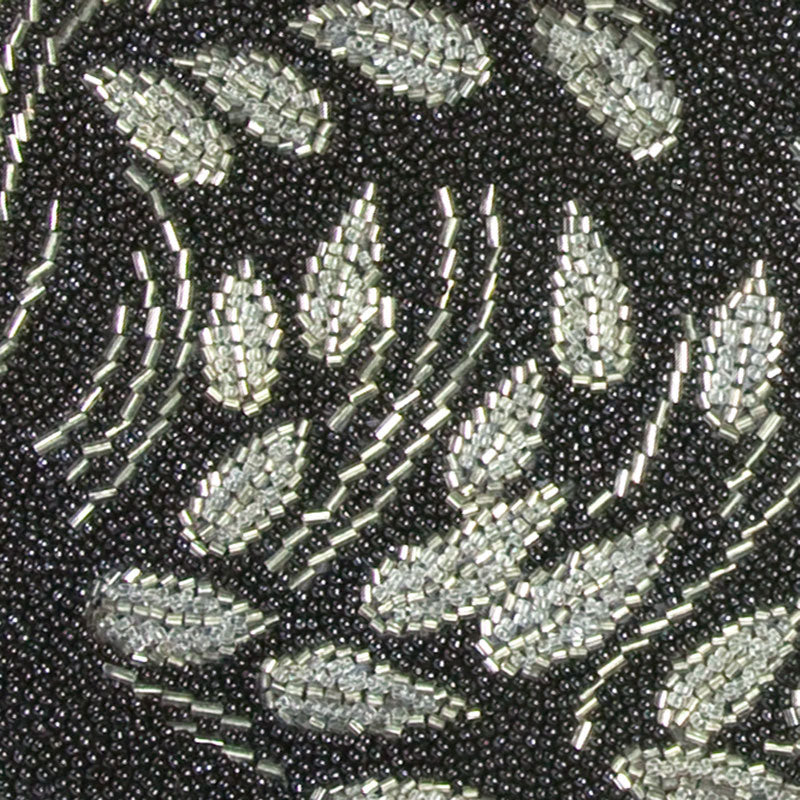 Close-up view of silver beaded floral design on front