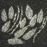 Close-up view of silver beaded design on back