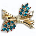 Flower brooch in blue topaz w/rubies & diamantes