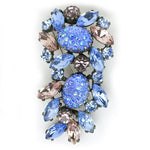 Schiaparelli art glass brooch in vertical position