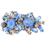 Schiaparelli brooch with blue art glass stones
