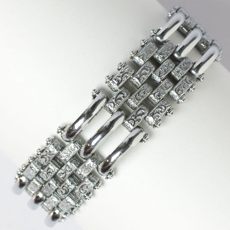 Chrome bracelet with curved & textured links