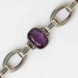 Close-up view of amethyst stone, oval panels & connecting links