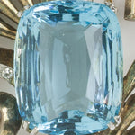 Close-up view of cushion-cut aquamarine glass stone