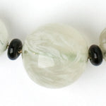 Close-up view of marbled-glass bead