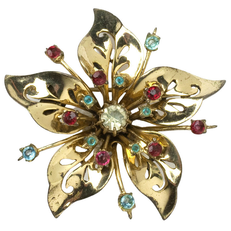 Vintage flower brooch by Coro with diamanté, aqua and ruby set in gold-plated sterling
